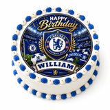 Blue and white frosted chelsea fc birthday edible cake with gold lettering and edible cake topper featuring team crest and soccer ball