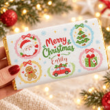 A festive white chocolate bar wrap with gold foil edges and colorful holiday illustrations for kids gifts