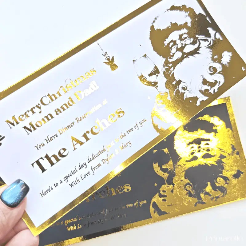 Gold and black Christmas card with decorative elements and text.