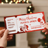 Ticket-like design with 'Merry Christmas Olivia & James' text, featuring cartoon characters, held by hands against a festive background.