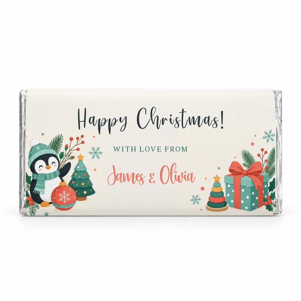 A festive personalised 40g white chocolate bar wrapped in silver foil with a penguin and christmas design