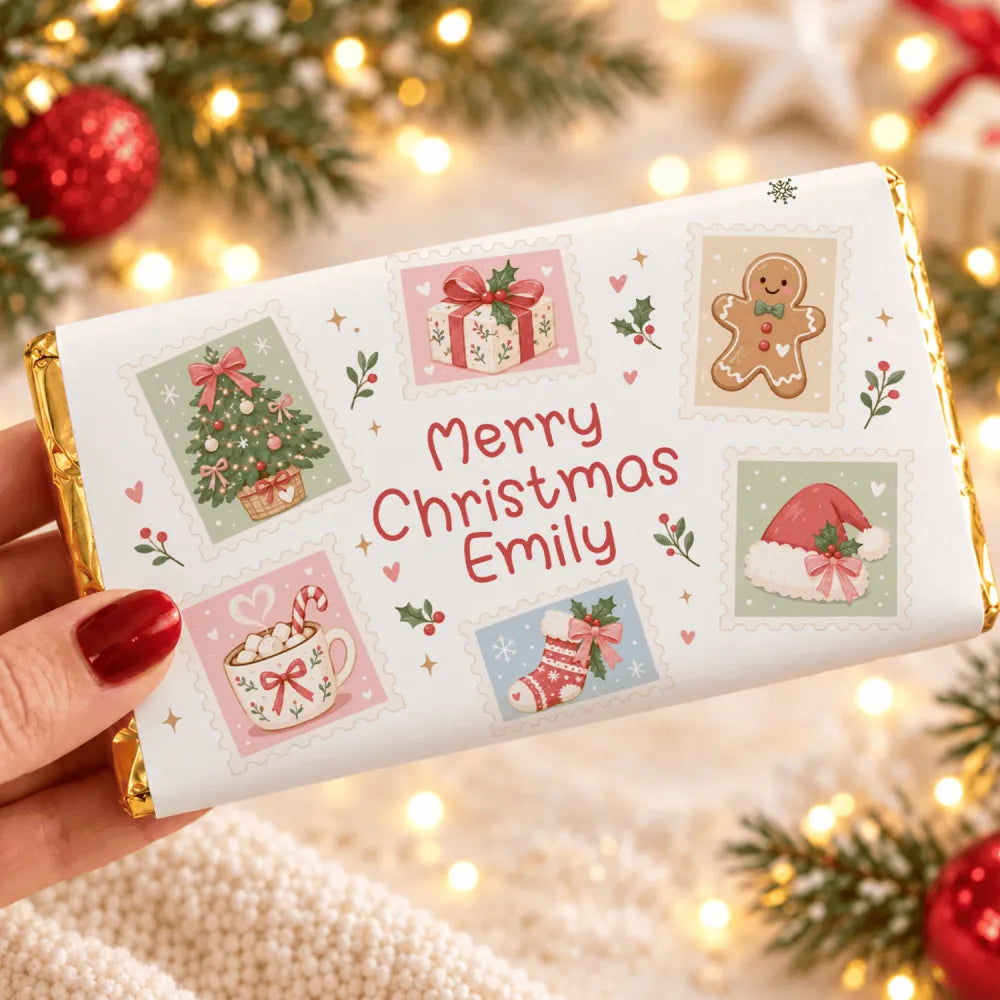 A personalized white christmas chocolate bar wrap with festive gingerbread man and merry christmas emily text in red script