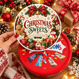 Red circular tin of christmas sweets with festive gingerbread man and candy canes illustrations and assorted chocolates