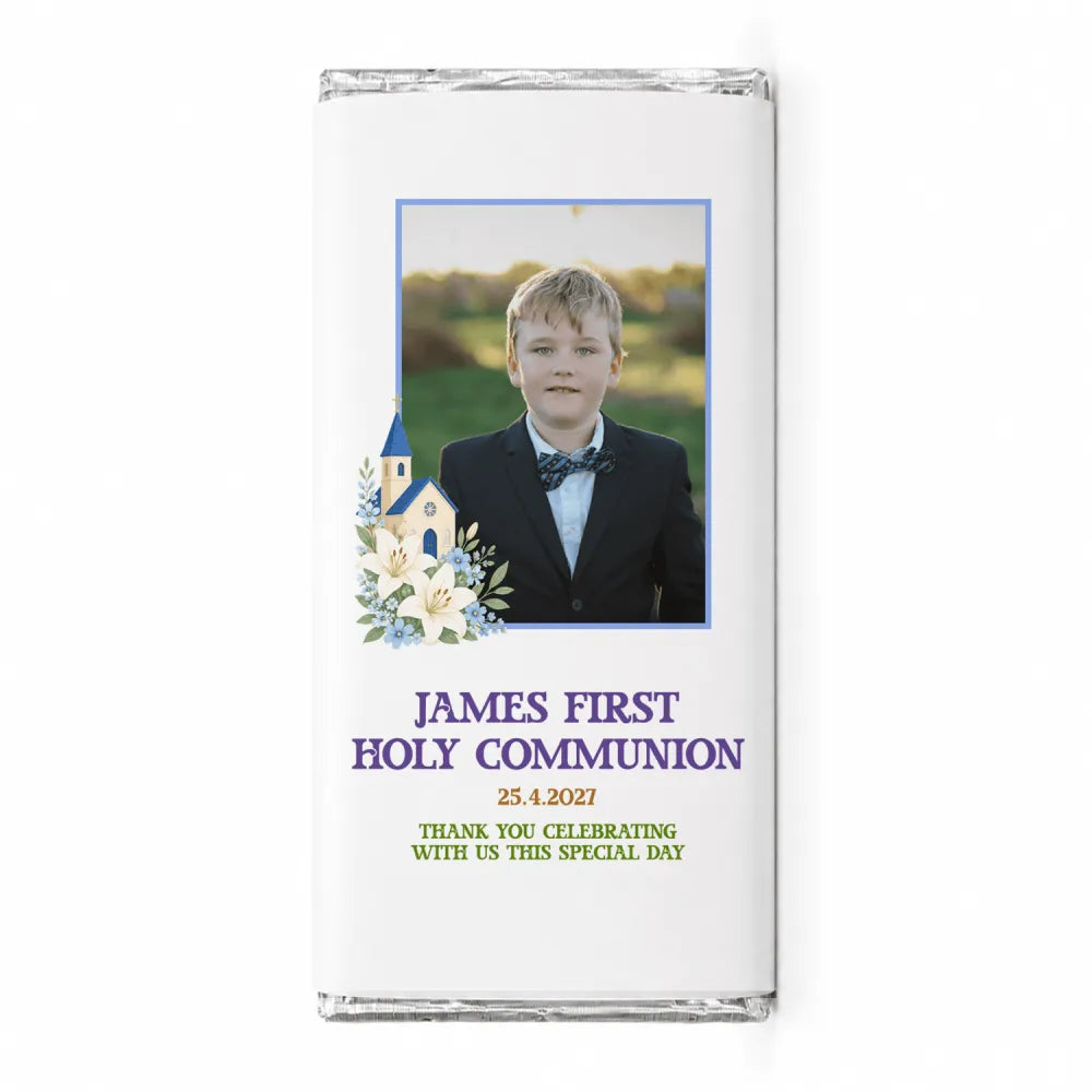 White personalised 40g chocolate bar with a photo of a boy in formal wear framed by church and lilies design for communion