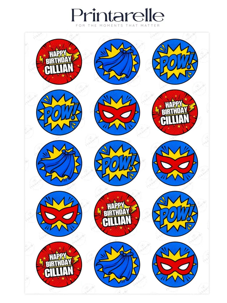 Blue and red edible superhero cupcake toppers with pow comic designs and happy birthday cillian text on icing sheet
