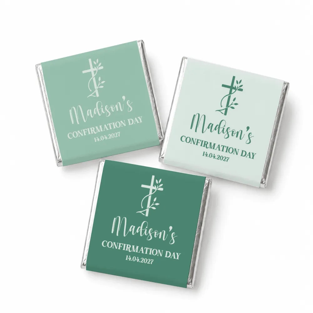 Three individually wrapped mini neapolitan chocolates in teal foil with white cursive confirming madisons day and cross design