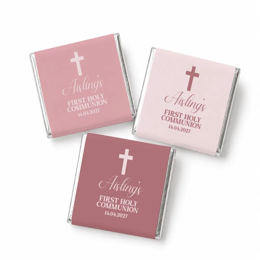 Pink and mauve mini neapolitan chocolates wrapped with white cross and aisling’s first holy communion print design