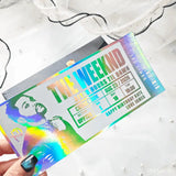 Holographic concert ticket for The Weeknd with colorful design on a white background