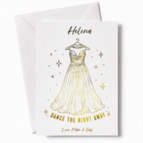 A white debs card featuring a gold foil illustration of an elegant strapless gown with stars in real gold foil
