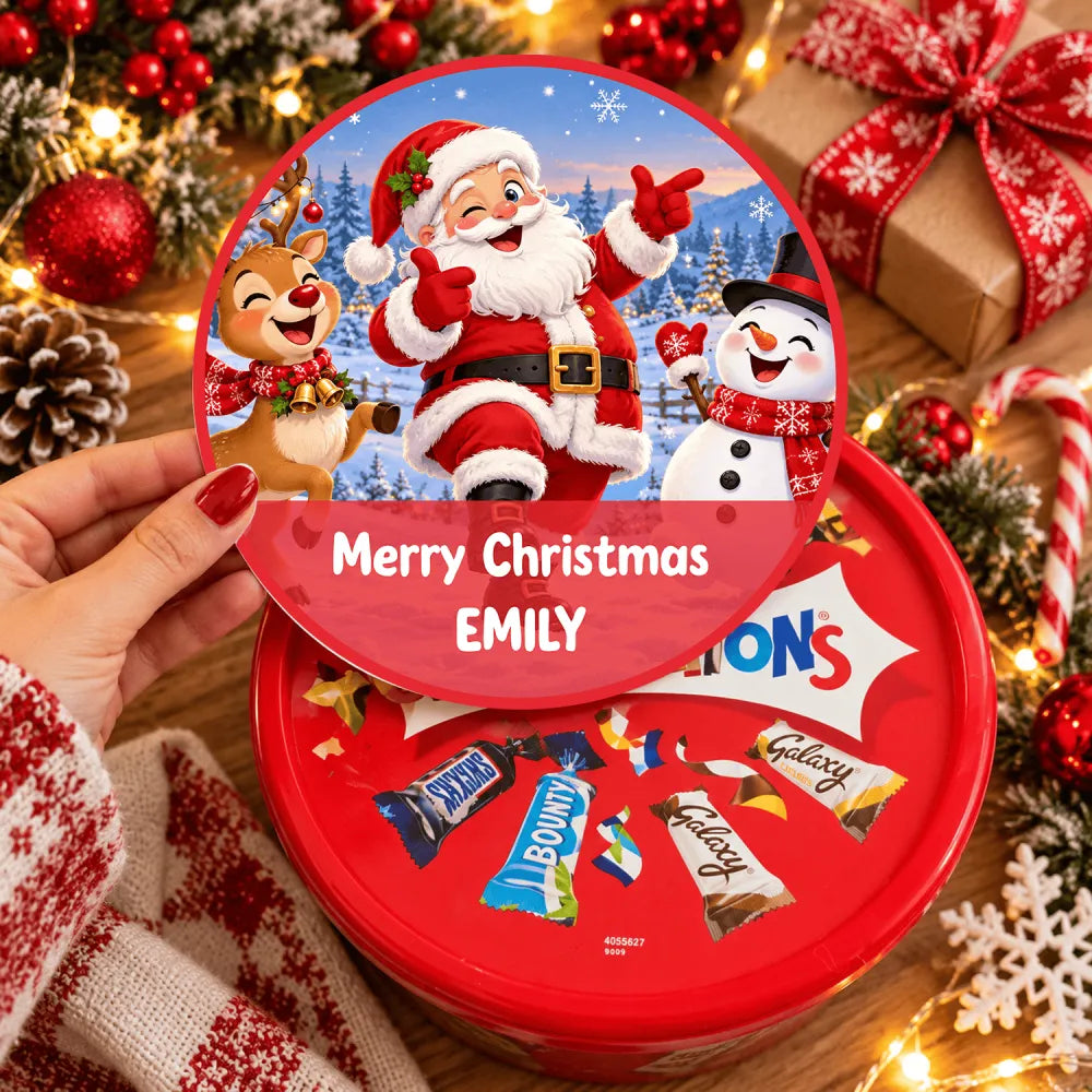 Red circular chocolate tin with dancing santa tub sticker featuring winking santa mid dance merry christmas emily label
