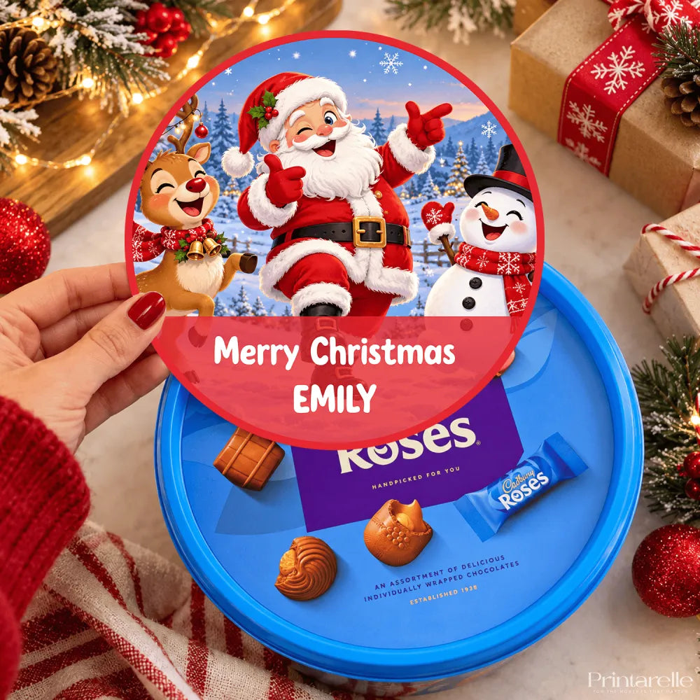 Personalized blue cadbury roses chocolate tin with dancing santa tub sticker featuring winking santa mid-dance design