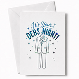 White debs card featuring holographic blue foil suit illustration and sparkling starbursts for debs night celebration