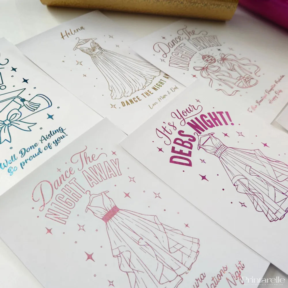 Pink and gold debs night suit card with holographic blue foil featuring elegant illustrated dresses for debs card use