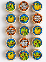 Dinosaur birthday cupcake toppers with green dinosaurs yellow eggs bold text on blue and orange icing sheet designs