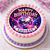 A round birthday cake with white frosting and pink purple borders featuring a vibrant disco ball icing sheet cake topper