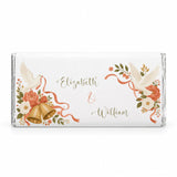 A personalised 40g chocolate bar with white chocolate wrapped in a wedding design featuring doves bells and flowers