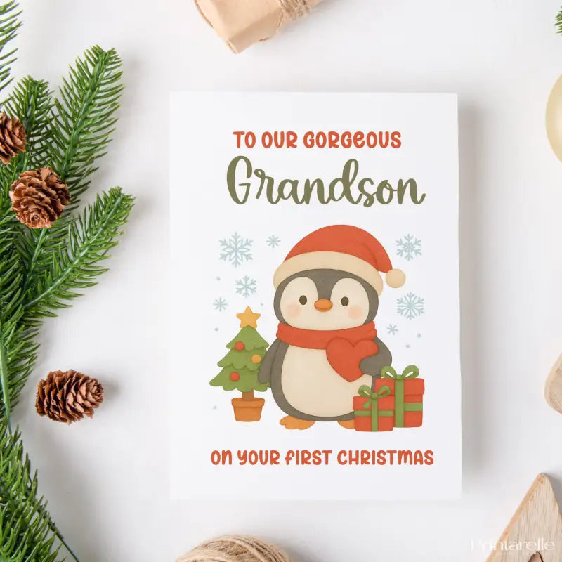 Christmas card with a penguin and text for a grandson on a white background with festive elements.