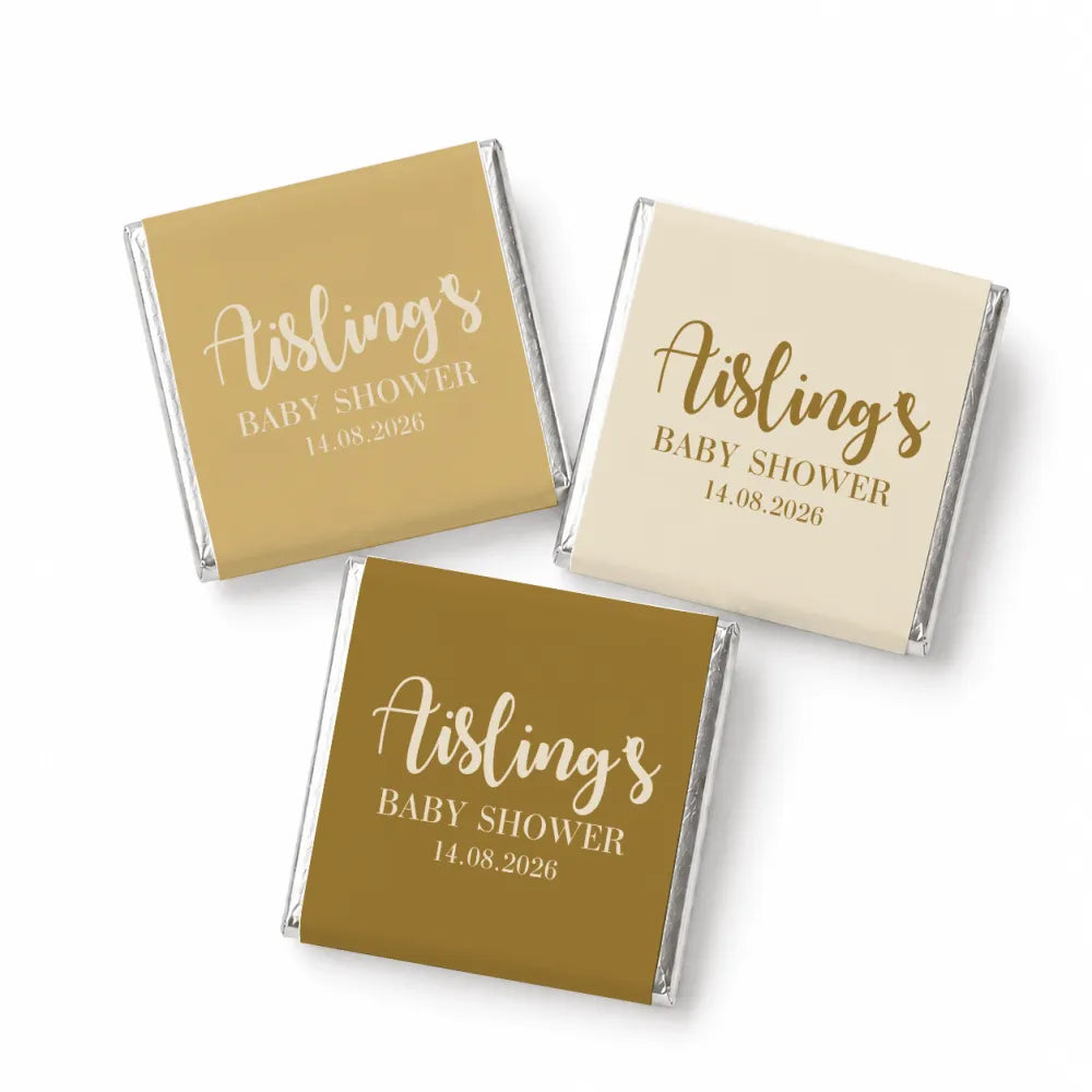 Three individually wrapped baby shower mini neapolitan chocolates with elegant script on matte gold and cream foil