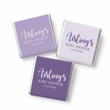 Lavender and white wrapped mini neapolitan chocolates with aisling’s baby shower printed for baby shower favours