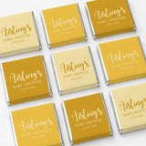 Elegant script mini neapolitan chocolates wrapped in gold and pale yellow foil for baby shower favours