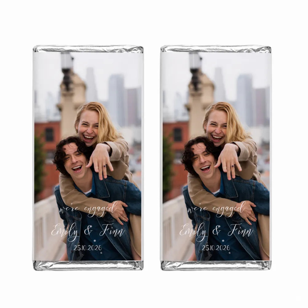 Personalised 40g chocolate bar with silver foil wrap and a photo of two people laughing on the front for engagement gifts