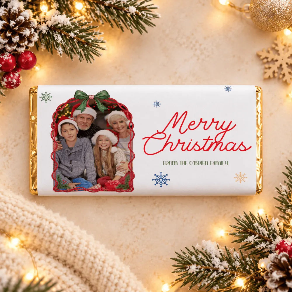 A personalized white chocolate bar with gold foil edges and a festive family photo chocolate bar wrap for christmas