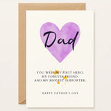 Father’s Day card with a large purple heart and “Dad” written across it. Message: “You were my first hero and biggest supporter.” Tell Dad he’s your forever hero. A heartfelt Father’s Day card with a purple heart and timeless message. Handmade by Printarelle.