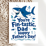 Blue cartoon shark father’s day card with youre fin-tastic dad text on premium cardstock and kraft envelope