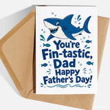 White father’s day greeting card with blue cartoon shark on premium cardstock and kraft envelope fin-tastic dad design