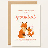 This First Father’s Day Card for Grandad features a heartwarming fox duo, parent and baby, gently nuzzling beneath