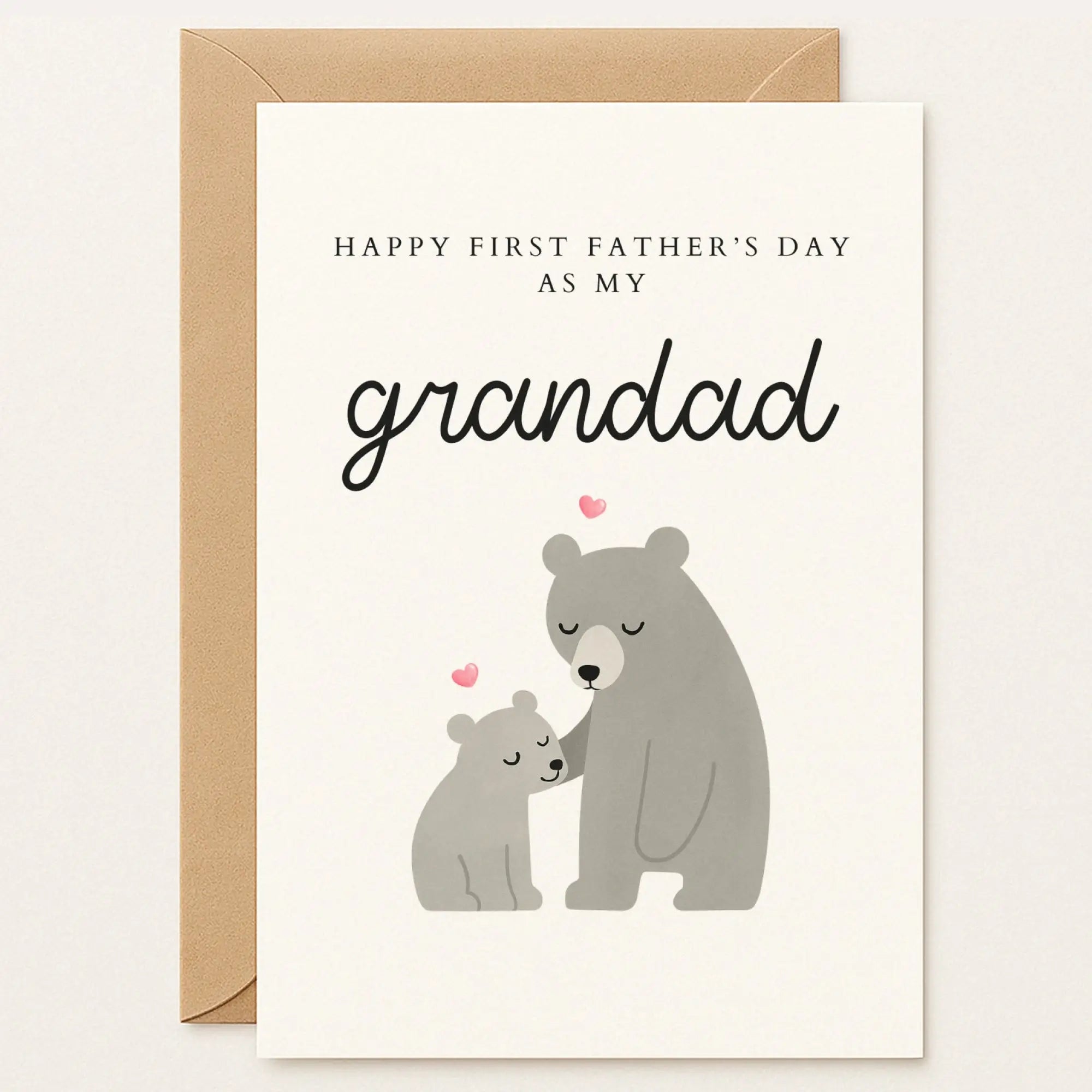 Father’s Day card with a large bear and cub snuggling. Text reads: “Happy First Father’s Day as my Grandad” with pink hearts above.