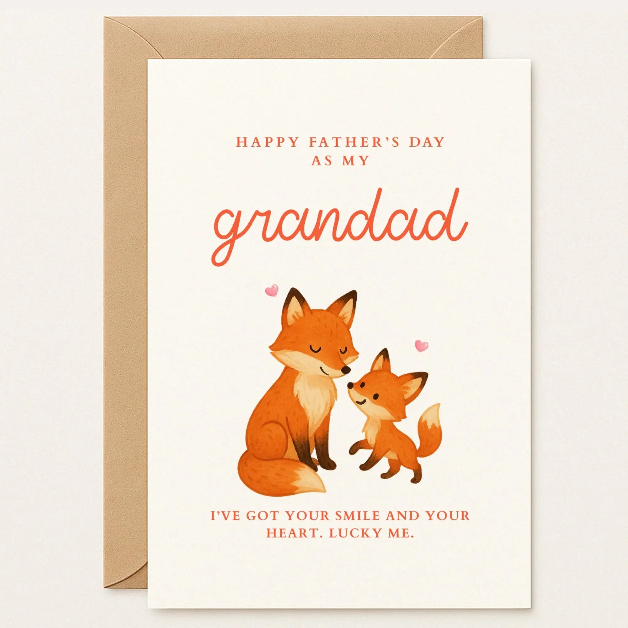 Father’s Day card featuring a parent and baby fox with pink hearts. Message: “I’ve got your smile and your heart. Lucky me.”