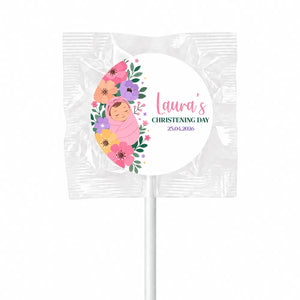 A personalized pink floral swaddle design lollipop wrapper with a sleeping baby for lauras christening day 25 04 2026