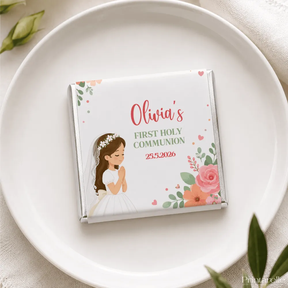 A personalized white chocolate mini neapolitan wrapped in silver foil with a girl in communion dress and floral design