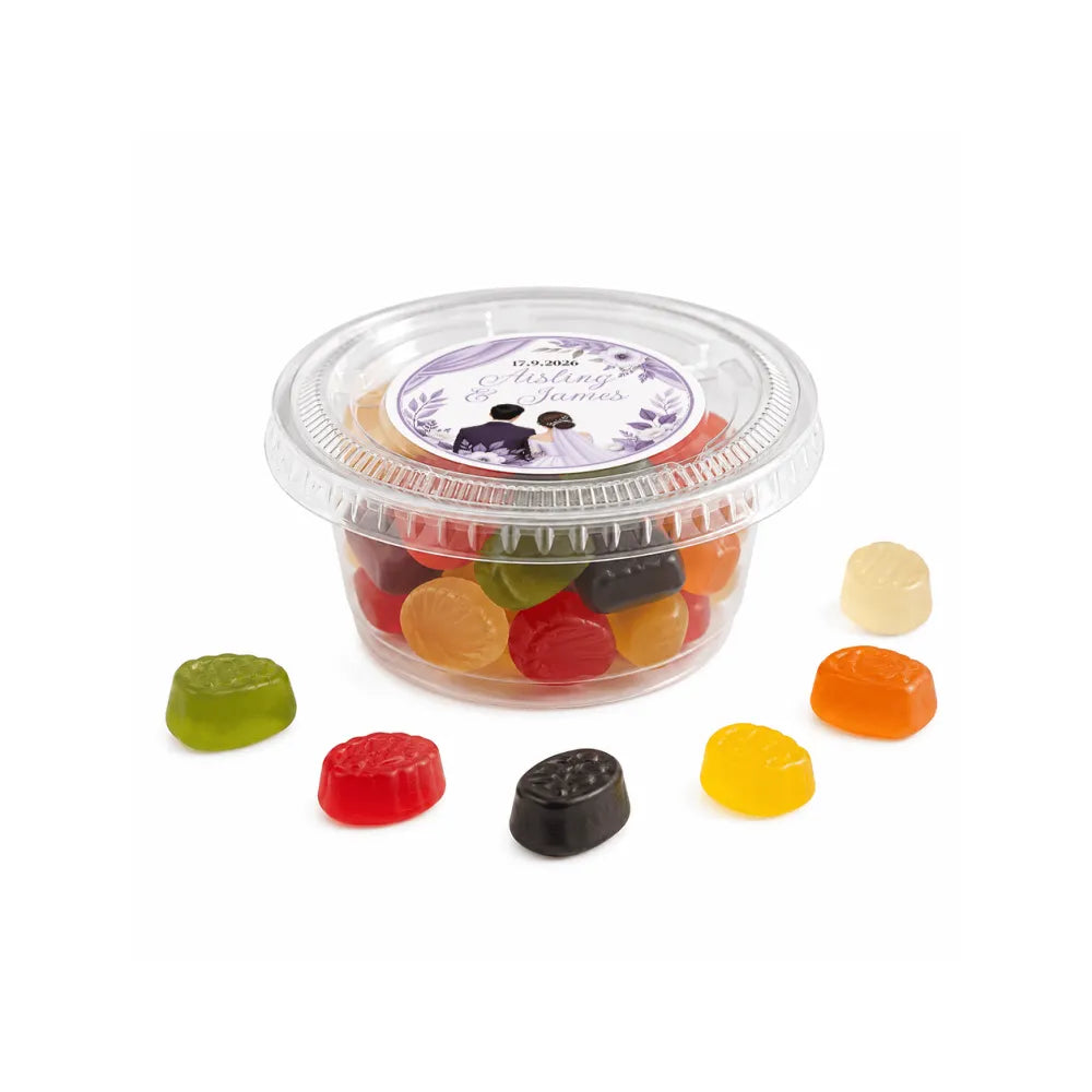 Clear plastic mini tub filled with colorful gummy candies sealed with a floral wreath foiled lid featuring a couple