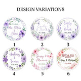 Circular floral wreath foiled wedding favor stickers in purple and pink with elegant script names and dates on 80g paper