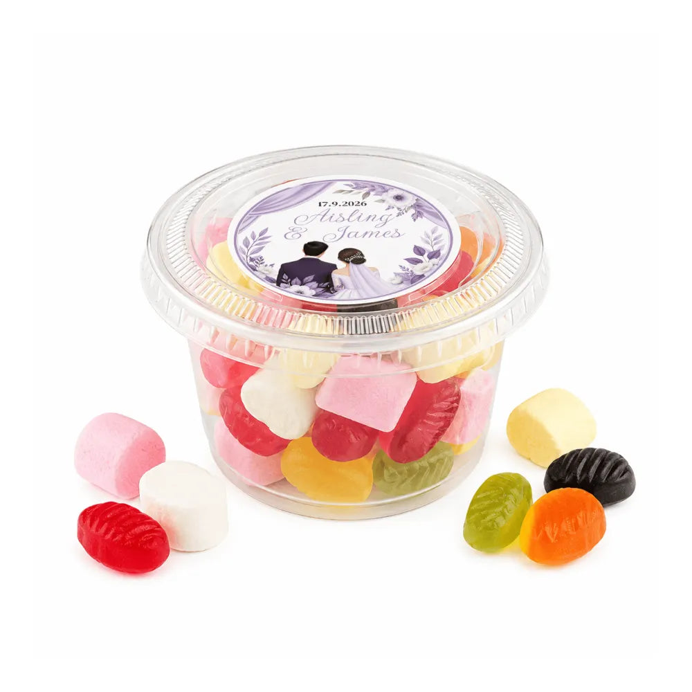 Clear plastic tub filled with colorful gummy candies featuring a floral wreath foiled sticker for weddings