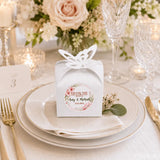 White paper wedding favour box with butterfly cutout and floral wreath thank you sticker for wedding favours