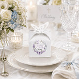 White paper favour box with butterfly cutout and lavender floral wreath sticker for emily and derek wedding favours