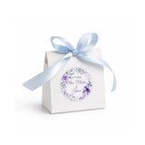 White paper favour box with floral wreath foiled purple sticker and light blue satin ribbon bow for wedding gifts