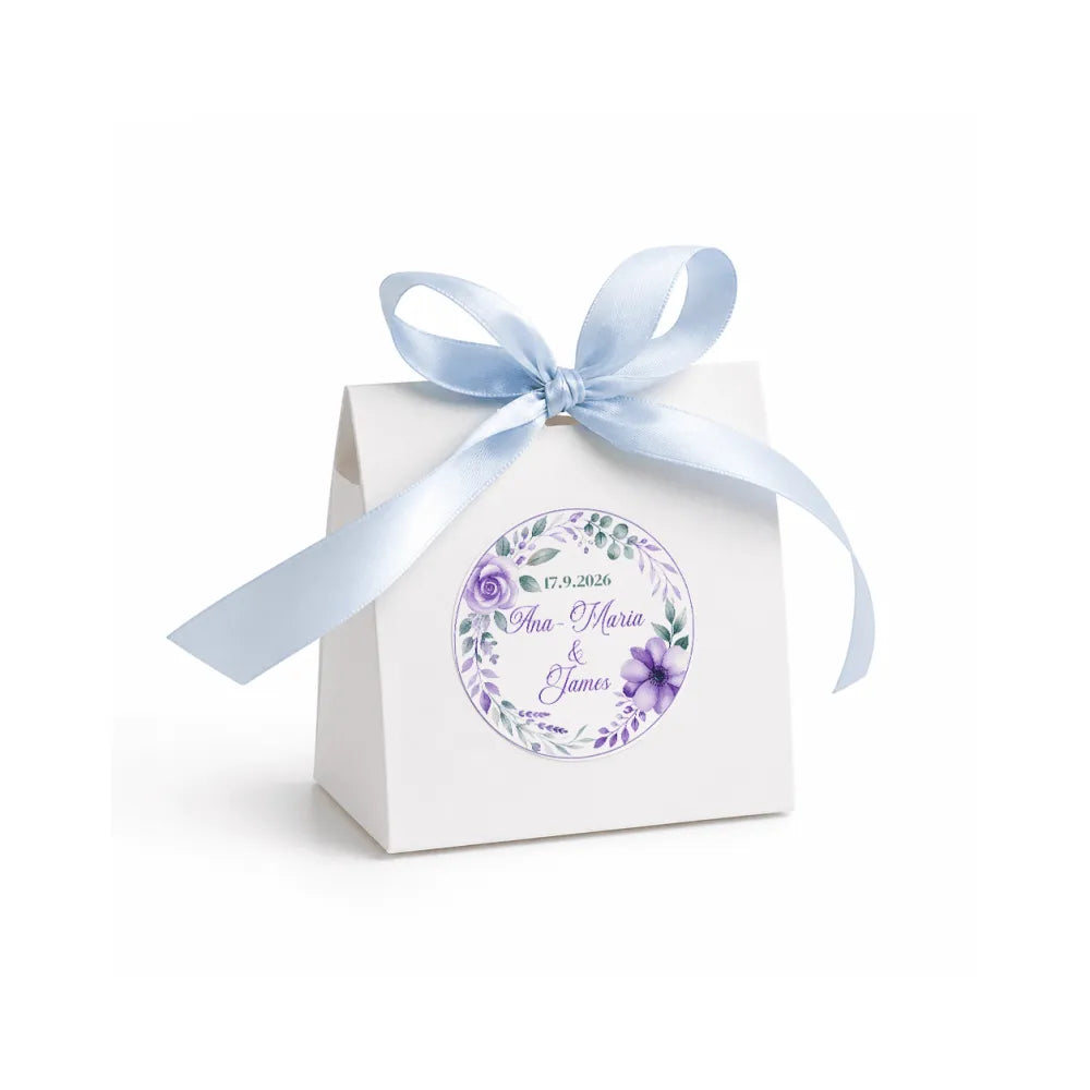 White paper favour box with floral wreath foiled purple sticker and light blue satin ribbon bow for wedding gifts