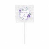 A purple floral wreath wedding foil sticker lollipop favour with ana-maria and james names wrapped fruit design