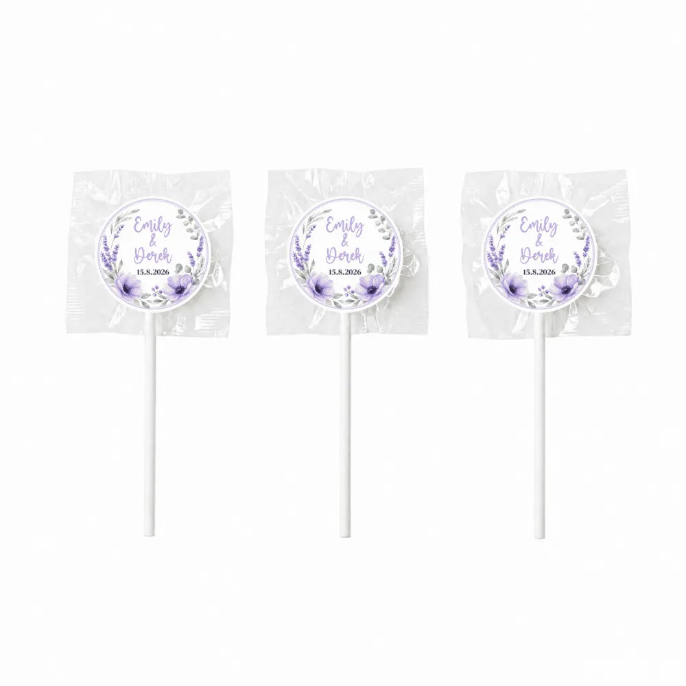 Three lavender floral wreath themed lollipop wedding favours wrapped in clear cellophane with white sticks
