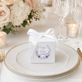 White cube favour box with floral wreath foil sticker and white satin ribbon bow for wedding gifts