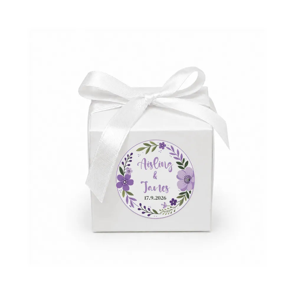 White cube favour box with floral wreath foil sticker and purple satin ribbon perfect for weddings