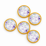 Purple floral-themed 40mm milk chocolate coins with gold foil edges personalized as wedding favours in floral wreath design