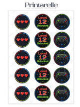 Black circular gaming birthday cupcake toppers with pixel hearts level unlocked text and video game controller design