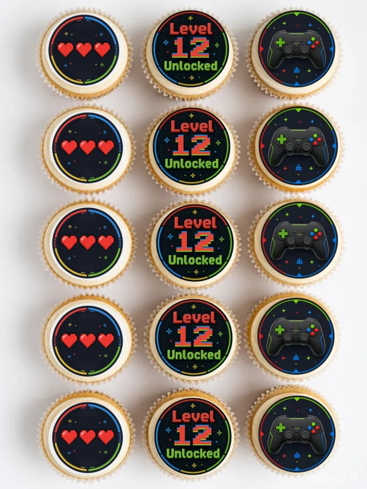 Gaming birthday cupcake toppers with pixelated level 12 unlocked text and black game controllers on dark backgrounds
