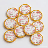 Gold-wrapped 40mm milk chocolate coins with pink floral designs and clara’s confirmation day 10.04.2026 printed centers
