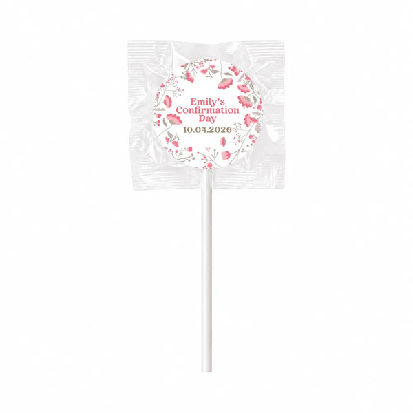 A pink floral patterned lollipop favour with emily’s confirmation day 10 04 2026 featuring fuller wreath and olive leaves designs